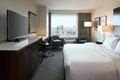 a hotel room with a bed and a television at Le Westin Montreal in Montréal
