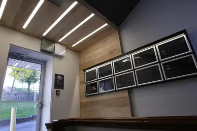 a waiting room with signs on the wall at Suite Marie-Thérèse in Vallée-Jonction