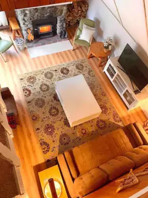 an overhead view of a living room with a couch and a fireplace at Le Rustique Orford Domaine Cheribourg in Magog-Orford