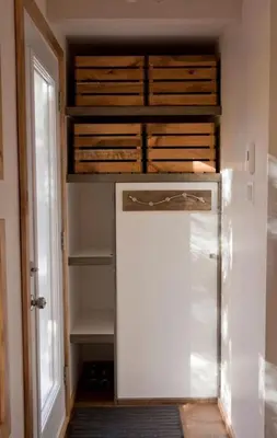 a kitchen with a refrigerator in a room at Le Cocon Orford Domaine Cheribourg in Magog-Orford