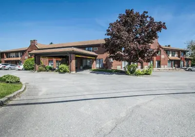 an empty parking lot in front of a building at Comfort Inn Sherbrooke in Sherbrooke