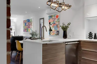 a kitchen with a sink and a counter top at LiV MTL Soho in Montréal