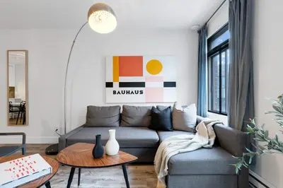 a living room with a couch and a table at LiV MTL Urban in Montréal