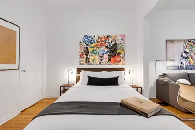 a bedroom with a bed and a couch at LiV MTL Avenue in Montréal
