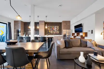 a living room with a couch and a table at LiV MTL Plato in Montréal