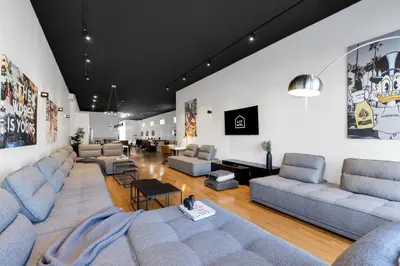 a large living room with couches and a table at LiV MTL Plaza in Montréal