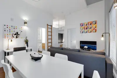 a living room with a couch and a table at LiV MTL Main in Montréal