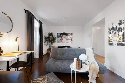 a living room with a couch and a table at LiV MTL Chic in Montréal