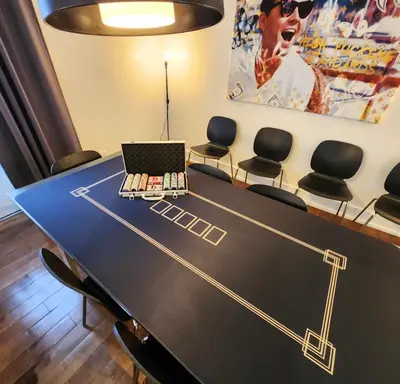 a conference room with a table with a laptop on it at LiV MTL Chic in Montréal