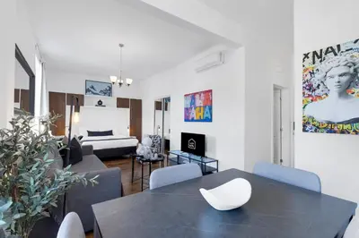 a living room with a table and chairs and a couch at LiV MTL MTL in Montréal