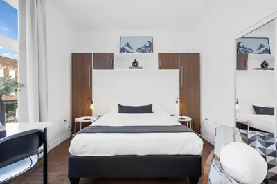 a bedroom with a king sized bed and a window at LiV MTL MTL in Montréal