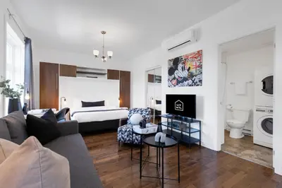 a living room with a couch and a bed at LiV MTL MTL in Montréal