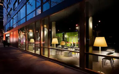 a window of a store with lamps in it at Hotel Zero 1 Montreal in Montréal