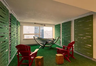 a room with chairs and a hammock in it at Campus1 MTL Student Residence Downtown Montreal in Montréal