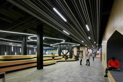 a lobby of a building with people walking in it at Campus1 MTL Student Residence Downtown Montreal in Montréal