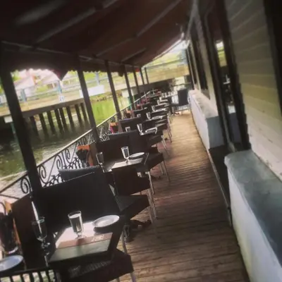 a row of tables and chairs at a restaurant at L'Appartement de la Suite North Hatley in North Hatley