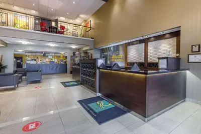 a lobby of a restaurant with a bar at Quality Inn & Suites in Victoriaville