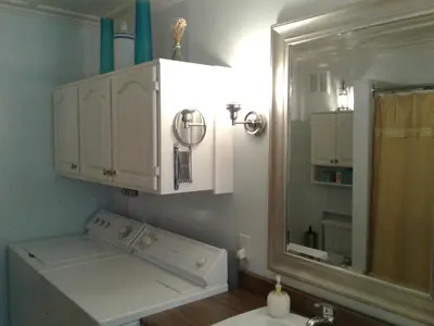 a bathroom with a sink and a mirror at Le Gîte Du Coteau in Lyster