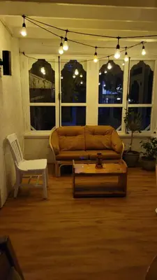 a living room with a couch and a chair at Auberge du Vignoble Bromont in Bromont