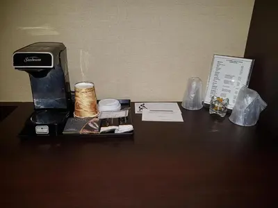 a table with a box and other items on it at Le Chabrol Hotel & Suites in Montréal