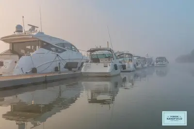 a group of boats docked at a dock in the water at Auberge Handfield et Spa in Saint-Marc-sur-Richelieu