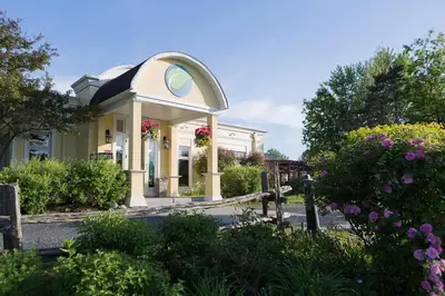 a house with a gazebo with flowers on it at Auberge West Brome in West Brome