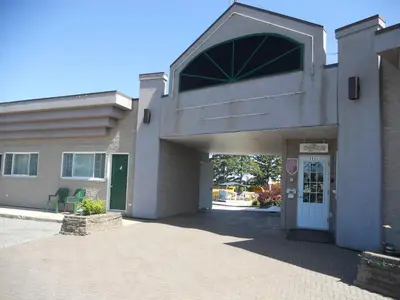 a building with a entrance to a building at Motel Normandie in Louiseville