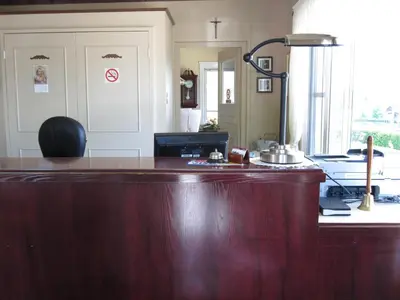 a kitchen with a wooden counter top in a room at Motel Saint-Hilaire in Mont-Saint-Hilaire