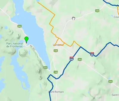 a map of a road with a green arrow on it at La Grange sur le Lac App A et B in Saint Romain