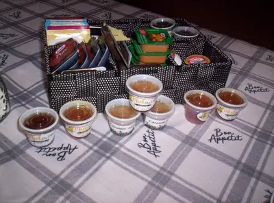 a table topped with cups of food on a table at Gîte Au p'tit bonheur B&B in Coaticook