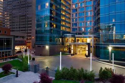 a large building with a courtyard in front of it at Courtyard par Marriott Montréal Centre-ville in Montréal