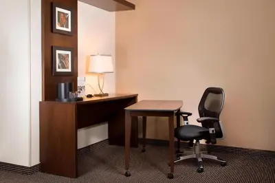a desk and a chair in a hotel room at Courtyard par Marriott Montréal Centre-ville in Montréal