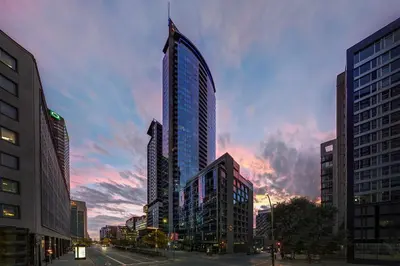 a tall building in the middle of a city at Courtyard par Marriott Montréal Centre-ville in Montréal