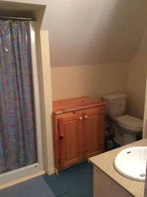 a bathroom with a toilet and a sink at Domaine Montauban in Saint Fortunat