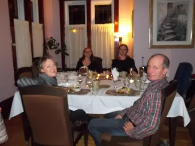 a group of people sitting around a table at Le 100 St-Laurent in Louiseville