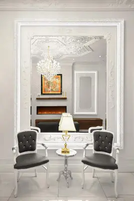 a room with two chairs and a table and a mirror at Hotel Bonaparte in Montréal