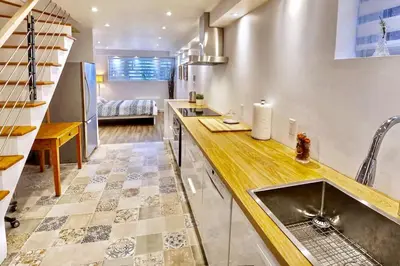 a kitchen with a sink and a counter top at Cosy apartment at Bossuet road in Montréal