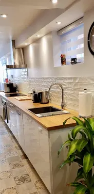 a kitchen with a sink and a counter at Cosy apartment at Bossuet road in Montréal