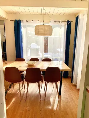 a dining room with a table and chairs and a window at Le Jackrabbit Orford Domaine Cheribourg in Orford