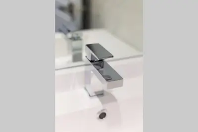 a bathroom sink with a faucet on a counter at Wonderful Studio in Little Italy with full bath by Den Stays in Montréal