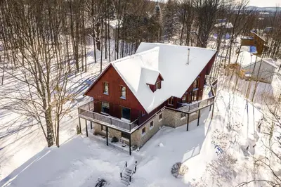 an aerial view of a house in the snow at La Bohème - Bed & Breakfast in Bromont