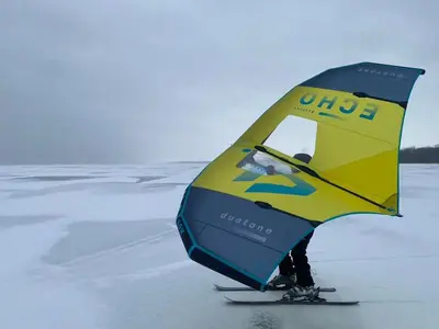 a person on skis with a yellow and blue at Chalets Multivoile 4 Saisons in Trois-Rivières