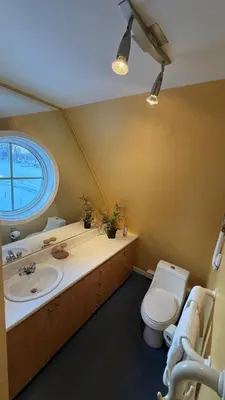 a bathroom with a toilet and a sink at Chalets Multivoile 4 Saisons in Trois-Rivières