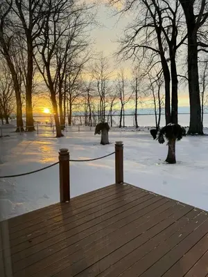 a wooden deck with a rope on it in the snow at Chalets Multivoile 4 Saisons in Trois-Rivières