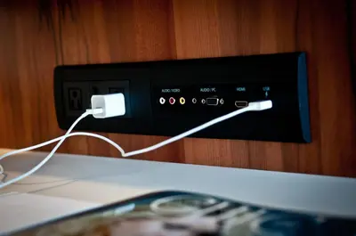 an electronic device with a cord plugged into it at Hôtel Alt Montréal in Montréal