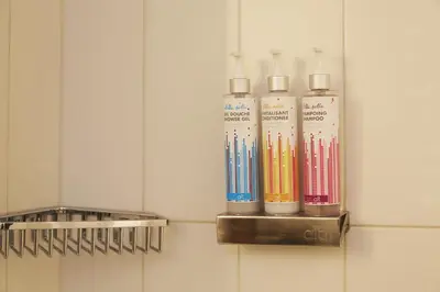 a row offluorescing chemicals in a wall at Hôtel Alt Montréal in Montréal