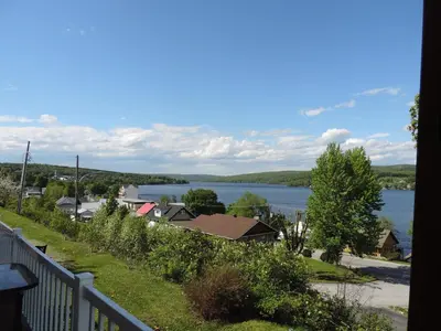 a view of a lake from a balcony at Chalets Garou in St-Ferdinand