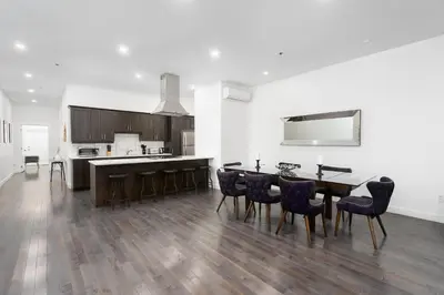 a kitchen with a dining room table and chairs at Boutique Lofts Notre Dame - Vieux Montréal in Montréal