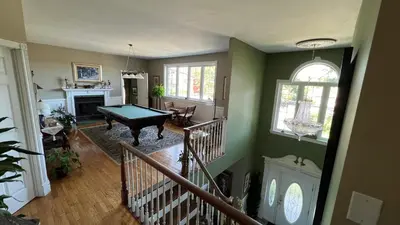 a living room with a pool table in it at Gîte du Caméléon in Sherbrooke
