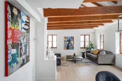 a living room with a couch and a table at Le Nomade MTL in Montréal
